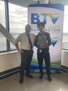 Ayush with Airport Director Nic Longo showing off his new swag during a tour of the airport.